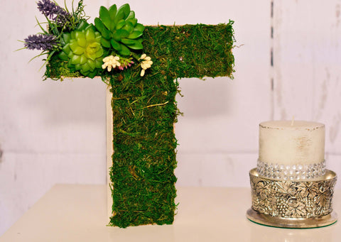 Moss covered letters for wedding are easy to create, and you can find a variety of designs and colors. The only thing that you need to consider is the type of paper and if it is suitable for your wedding venue. If you're looking for a non-traditional look, you can choose cotton-based papers and use them to make terrarium centerpieces. Then, spray them with adhesive. You can also use moss that has been dried.